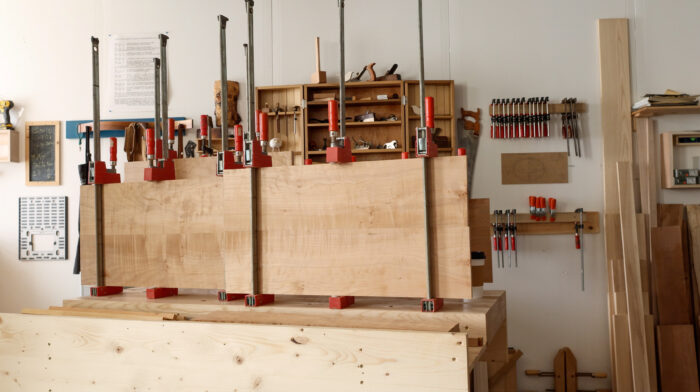 Boards clamped together in a wood shop